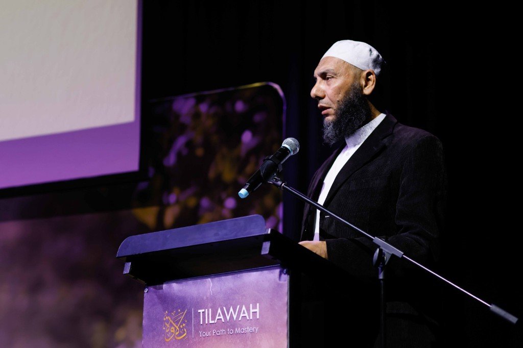 Scholar speaking at the Tilawah podium during the evening program
